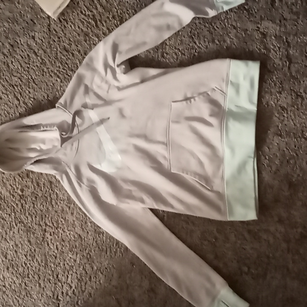 Nike sweater color is Grey and a light blue size L